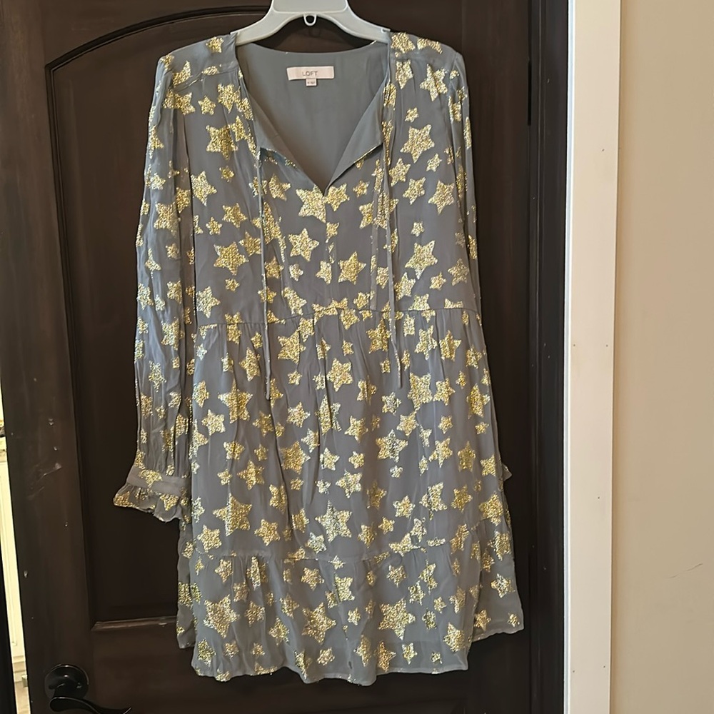 Gold star dress.  Or can be worn as a top with leggings. Brand new without tags
